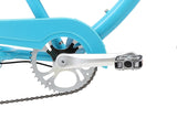 Close-up of a bicycle's chain and gear system with a blue frame.