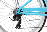 Close-up of a blue bicycle frame with chain and gears on a white background